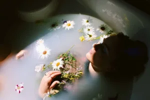 Person practicing hot water meditation in a bath